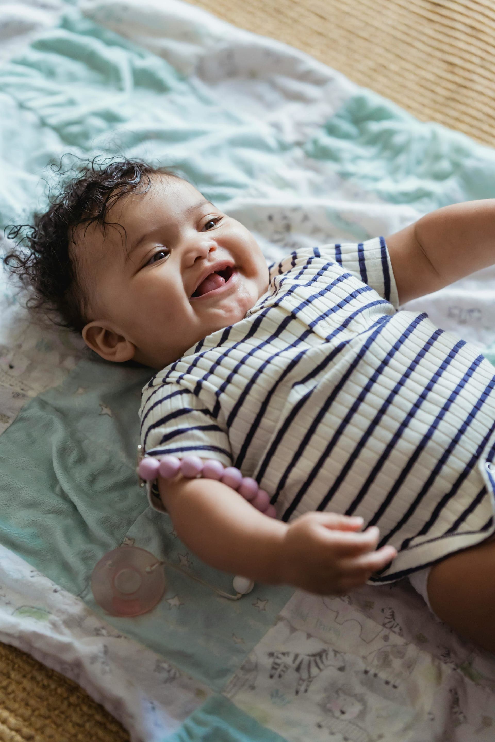 Happy baby lying on their back